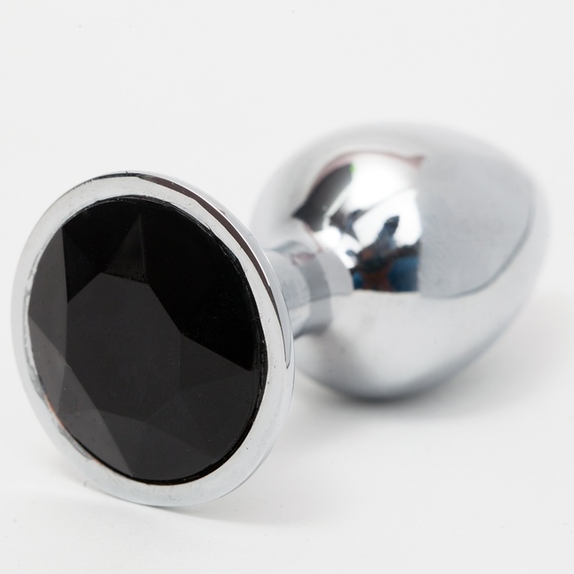 Серебристая анальная пробка с черным кристаллом - 8,2 см.