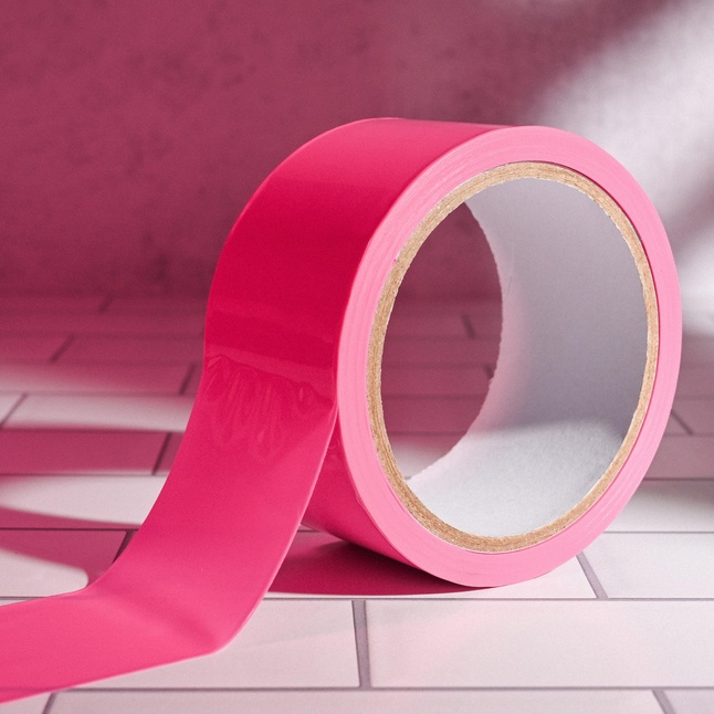 Розовая лента для бондажа Pink Bondage Tape - 20 м. Фотография 7.