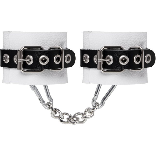 Бело-черные кожаные наручники с одним ремешком с люверсами. Фотография 3.