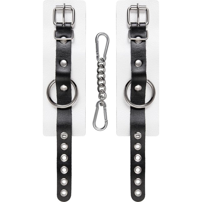 Бело-черные кожаные наручники с одним ремешком с люверсами. Фотография 4.