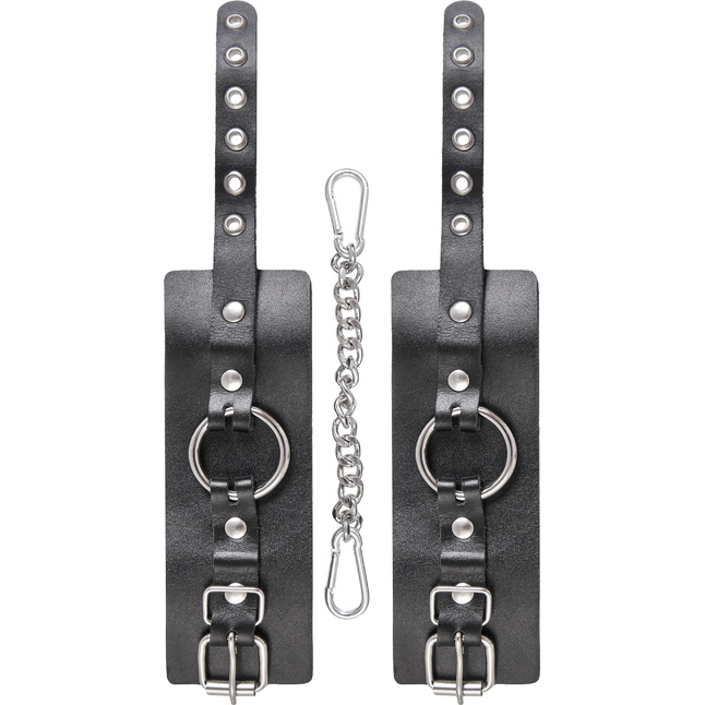 Черные наручники из толстой натуральной кожи с люверсами. Фотография 5.