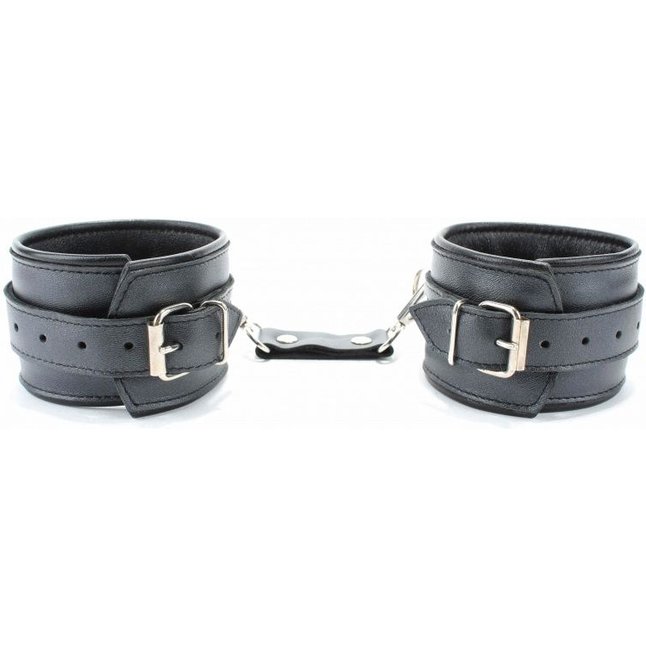 Черные кожаные наручники с металлическими клепками. Фотография 3.