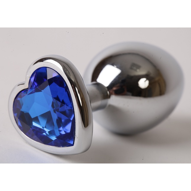 Серебристая анальная пробка с синим кристаллом-сердцем - 9 см