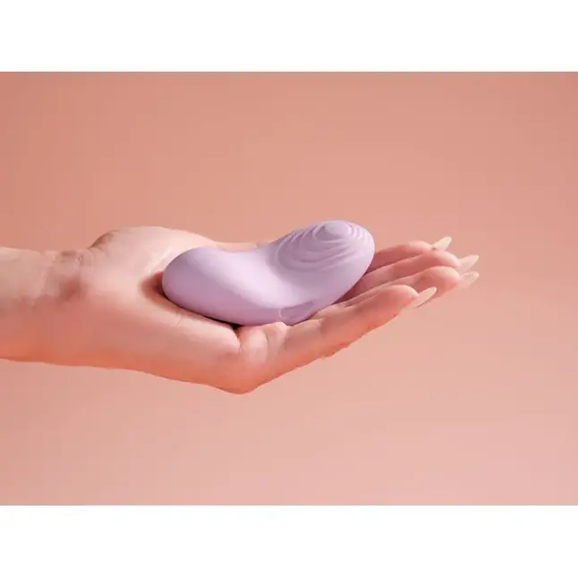 Сиреневый вибромассажёр на пальцы Echo 2 с функцией нагрева. Фотография 9.